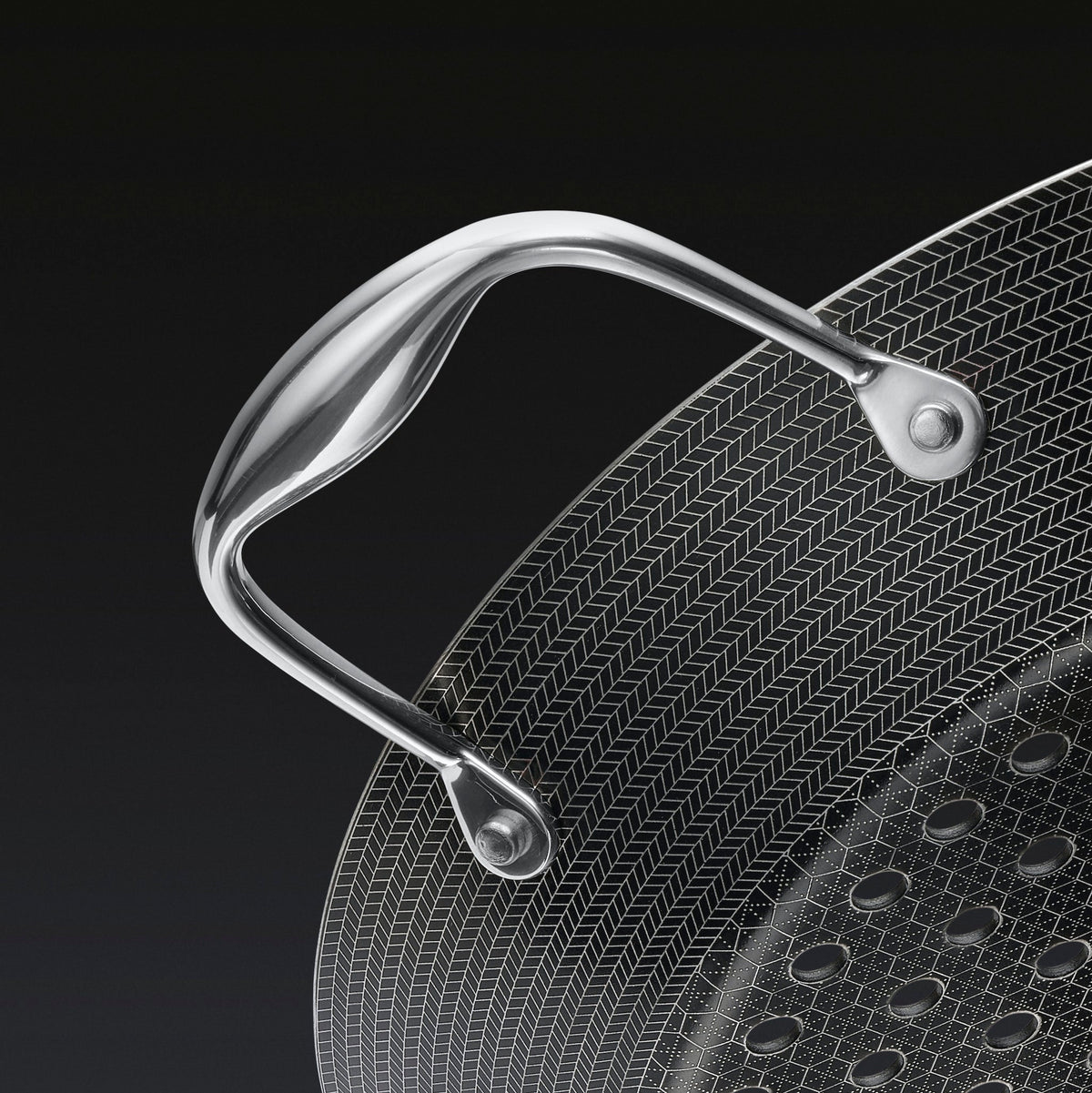 A close up of the handle of the HexClad 12&quot Hybrid BBQ Grill Pan